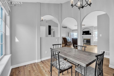 Dining room featuring lofted ceiling, an inviting 