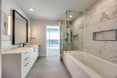 Bathroom with vanity, tile patterned flooring, and