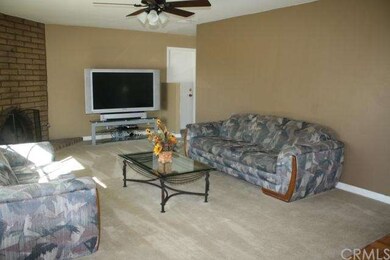 Living Room - door way into dining room.  Door to 