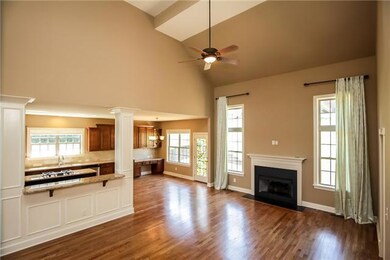 2-story great room with fireplace is open to kitchen which is perfect for entertaining.