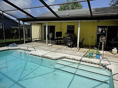 Covered patio area overlooks pool.