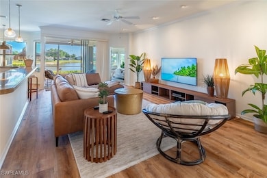 Living area featuring baseboards, wood finished fl