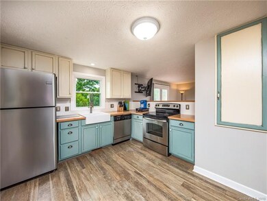 Kitchen attractively updated with new flooring, st