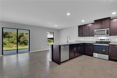 Kitchen with appliances with stainless steel finis
