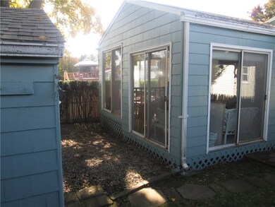 BACKYARD SHOWING SUNROOM