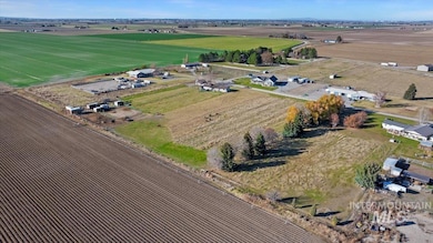 Aerial view of property's location featuring rural landscape and abundant farmland
