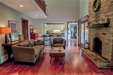 living room with gas fireplace and double doors to