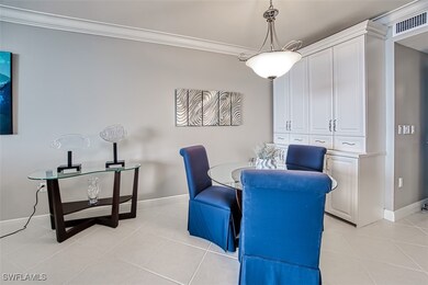 Dining space featuring ornamental molding and ligh