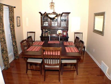 Formal Dining room also has wonderful wood floorin