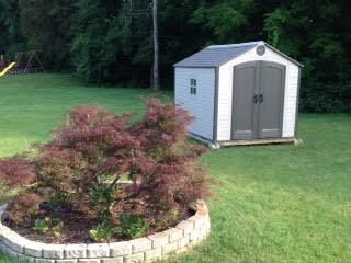 LRG YARD BACKS UP TO WOODS...OUTBUILDING REMAINS WITH PROPERTY