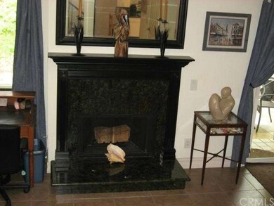 Custom living room fireplace matching kitchen gran