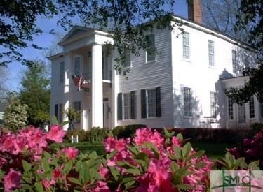 Exterior front with Azaleas in bloom