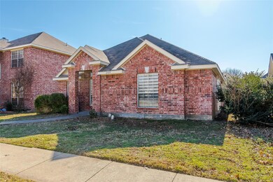 View of front of house with a front yard