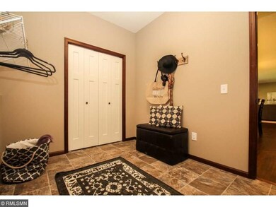 Roomy mudroom with great storage closet. Photo is 