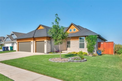 View of front of house with a front lawn, a garage, roof with shingles, and driveway