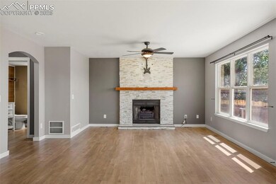 Unfurnished living room with hardwood / wood-style
