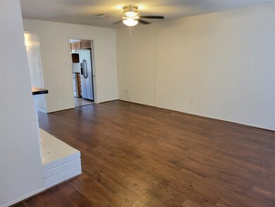 Beautiful hardwoods and fresh paint greet you upon