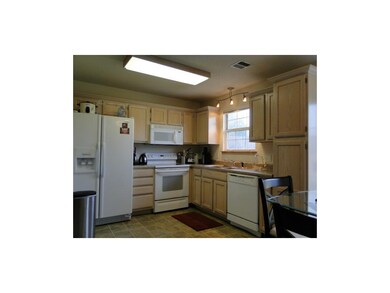 Spacious kitchen with large pantry.  Window looks 