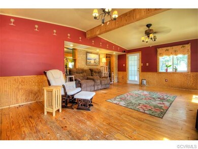 Large family room with hardwood floors, newer wind