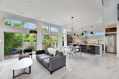 Living room with concrete floors and recessed lig