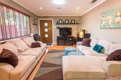 Living room with hard wood floors, large dual pane