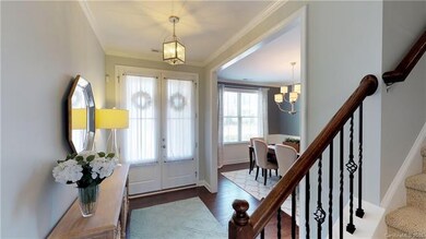 A double glass door & covered front porch invite g