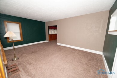 LIVING ROOM OPEN TO FORMAL DINING ROOM