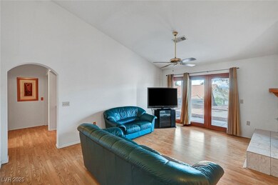Living area featuring high vaulted ceiling, visibl