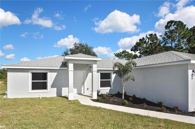 Ranch-style house with a front lawn, stucco siding, and roof with shingles