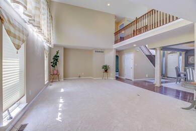 Family room open to dining room and kitchen.