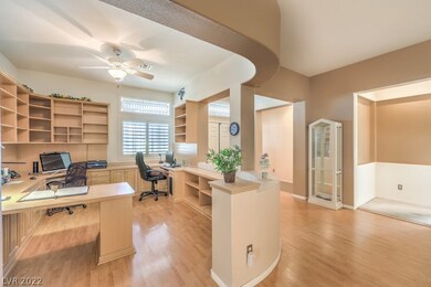Office with plenty of bookshelves and desk space.