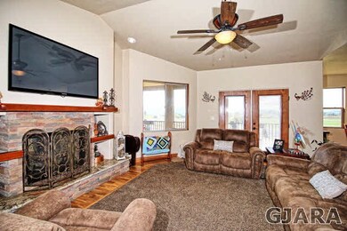 A two-sided gas-log fireplace adds to the already 
