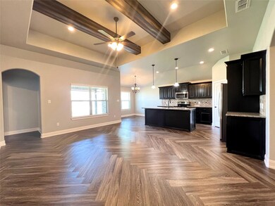 Open concept, parquet floors, decorative light fix