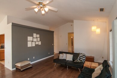 living room with vaulted ceilings