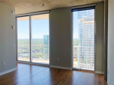 Empty room with a wall of windows, healthy amount