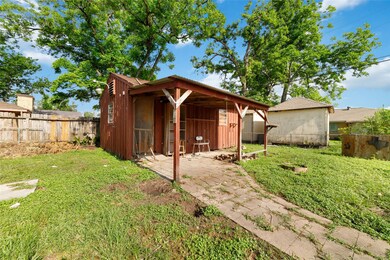 This photo showcases a rustic wooden shed in a spa