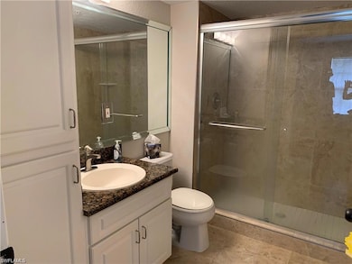Bathroom featuring tile patterned flooring, a show