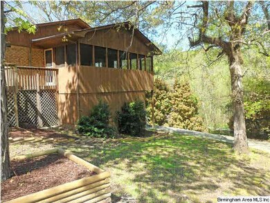 Off the side of the house is a large sunroom for y