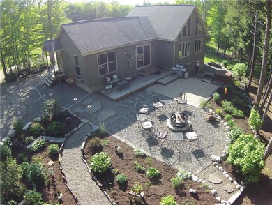 Upper patio leads to firepit area...