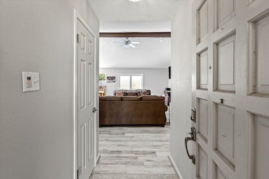 The front entry hall going towards the family room
