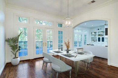 French doors open to the balcony that expands the