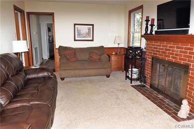 The Family Room has a wood burning brick fireplace