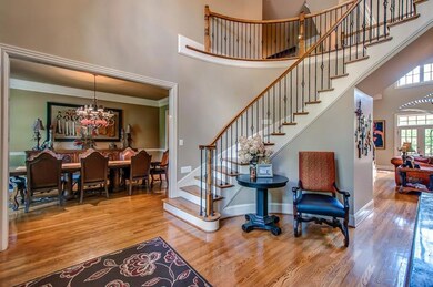 Spiral staircase in entry.  Lots of natural light.