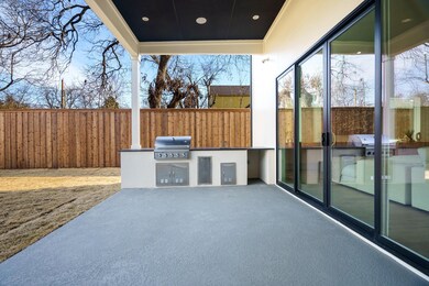 View of patio with an outdoor kitchen and grilling