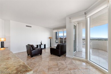 Living area featuring light marble finish floors a