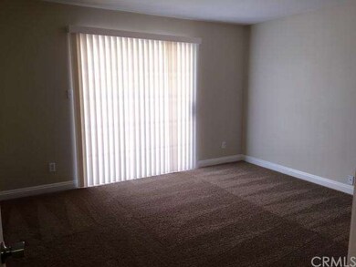 Master bedroom with sliding glass door to back yar