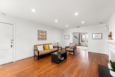 Large living and dining room with faux fire place