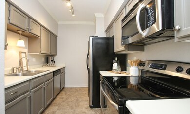 Kitchen with grey cabinets.