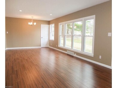 Living room and dining room are open.