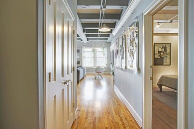 Beautiful wood floors bring you into the main livi